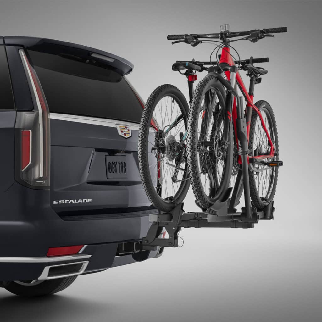 SUV with bike rack carrying two mountain bikes on the rear, highlighting outdoor adventure gear.
