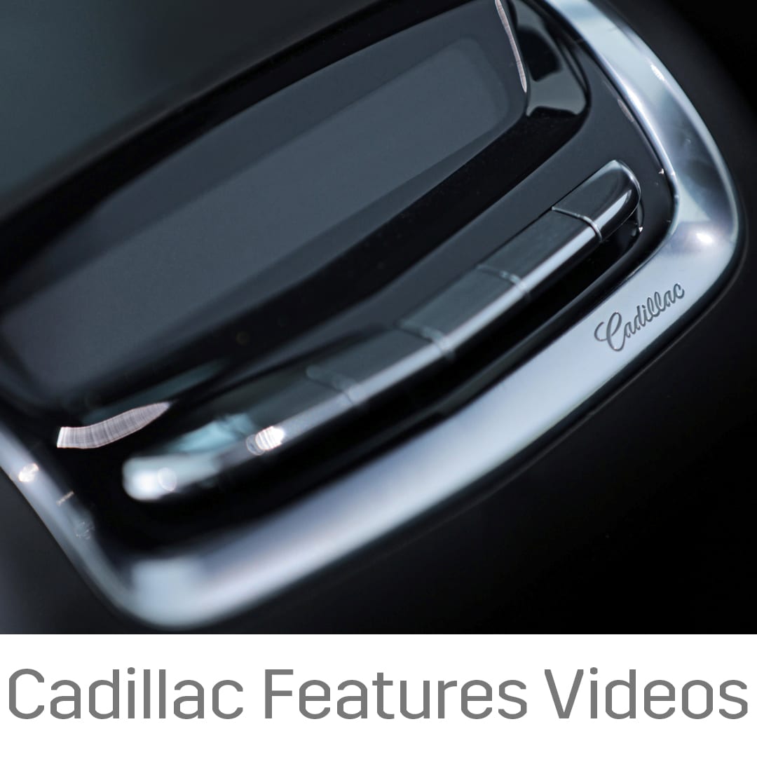 Cadillac interior control panel detail with logo, highlighting luxury car features.