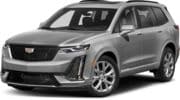Sleek black luxury sedan with modern grille design, stylish wheels, and aerodynamic profile.