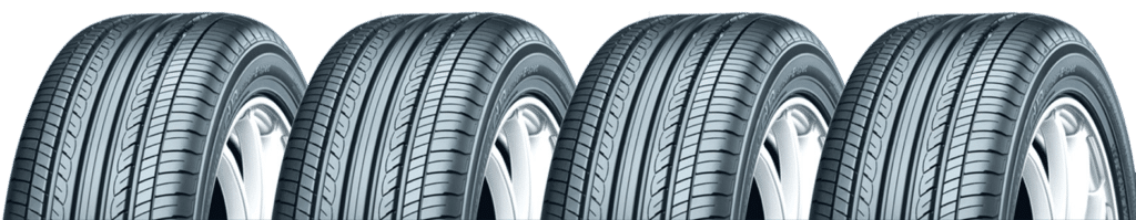 Four all-season car tires with symmetrical tread patterns for enhanced grip and performance.